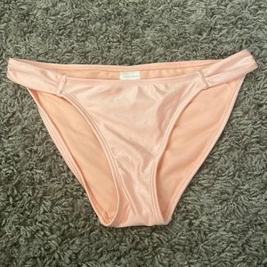 pink colored swim suit bottoms